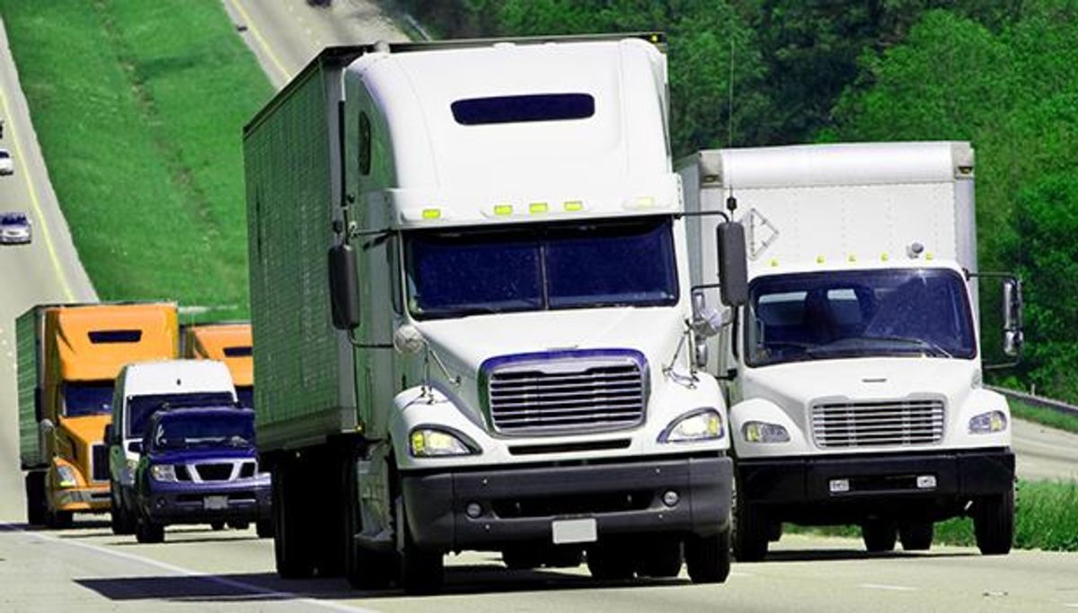 Trucks driving on the highway.